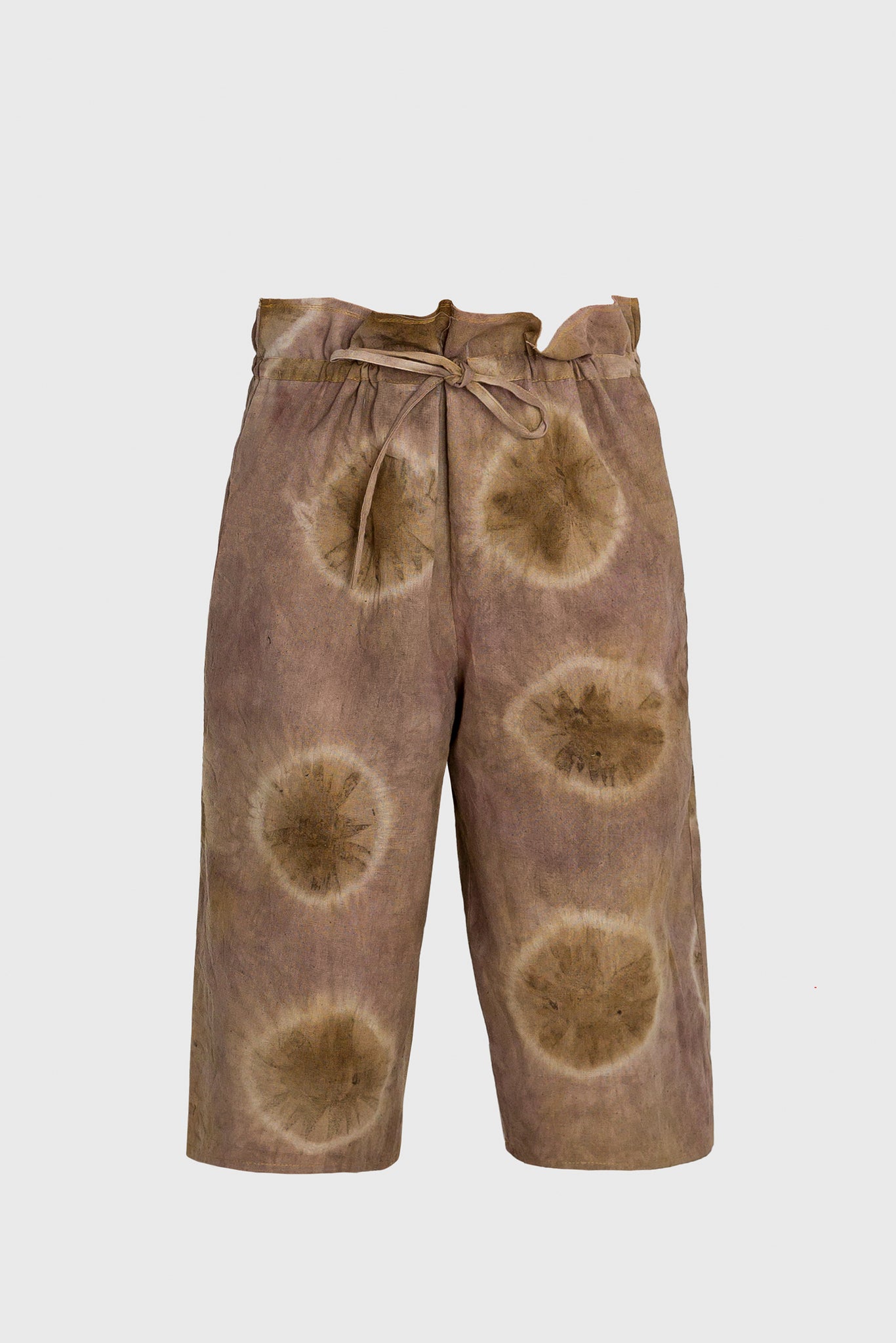 the new shorts for this summer, women and men, unisex design, naturally dyed, chemical free, high end young luxury, design oriented fashion, for a sustainable lifestyle, earth-tone colors, shibori circles