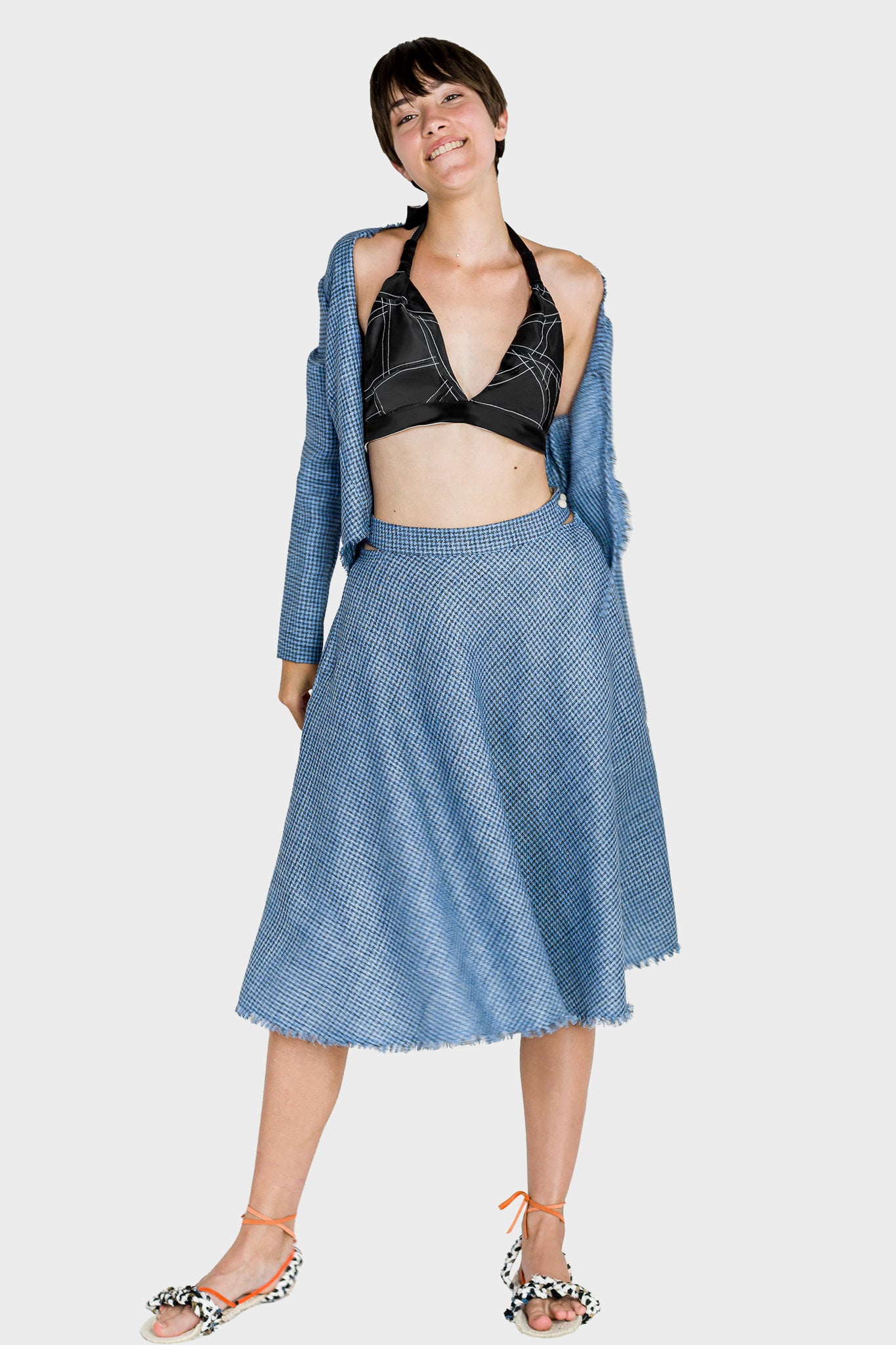 Ruxandra, luxury look, houndstooth pattern bias cut skirt with black silk bra and matching blouse, sexy and elegant, youthful energy, fringed details, side cutouts showing your hops underneath the skirt
