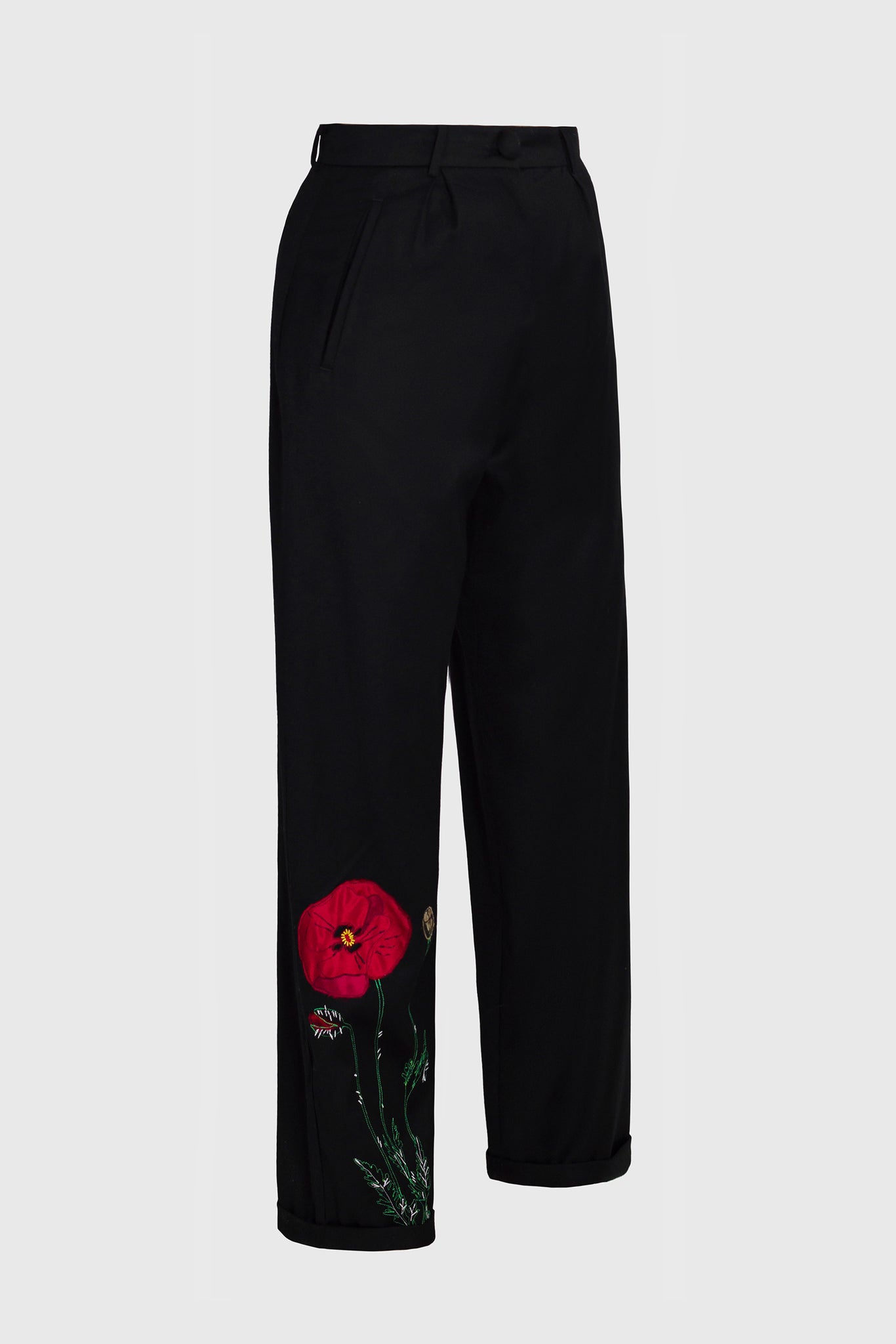 stylish straight long trousers, crafted in soft deep black wool, luxurious feeling, for knowledgeable women of tailored fashion, office and business attire, business women fashion, for nature lovers, hints of nature, poppy flower embroidery on right leg