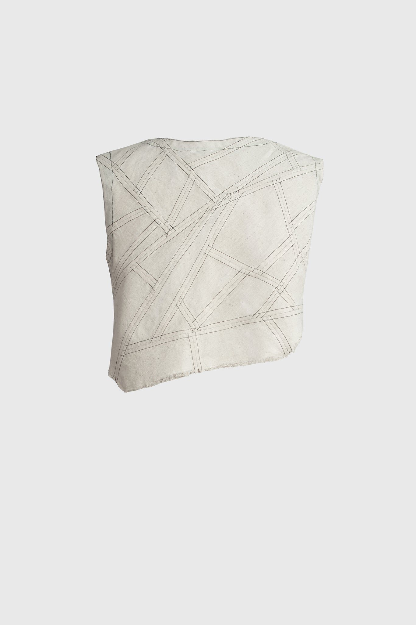 Cropped top, with signature geometric irregular patchwork design, tedious technique, fringed edge, irregular hemline, round sleeve cuts, spring summer style, cool, white rock fashion 