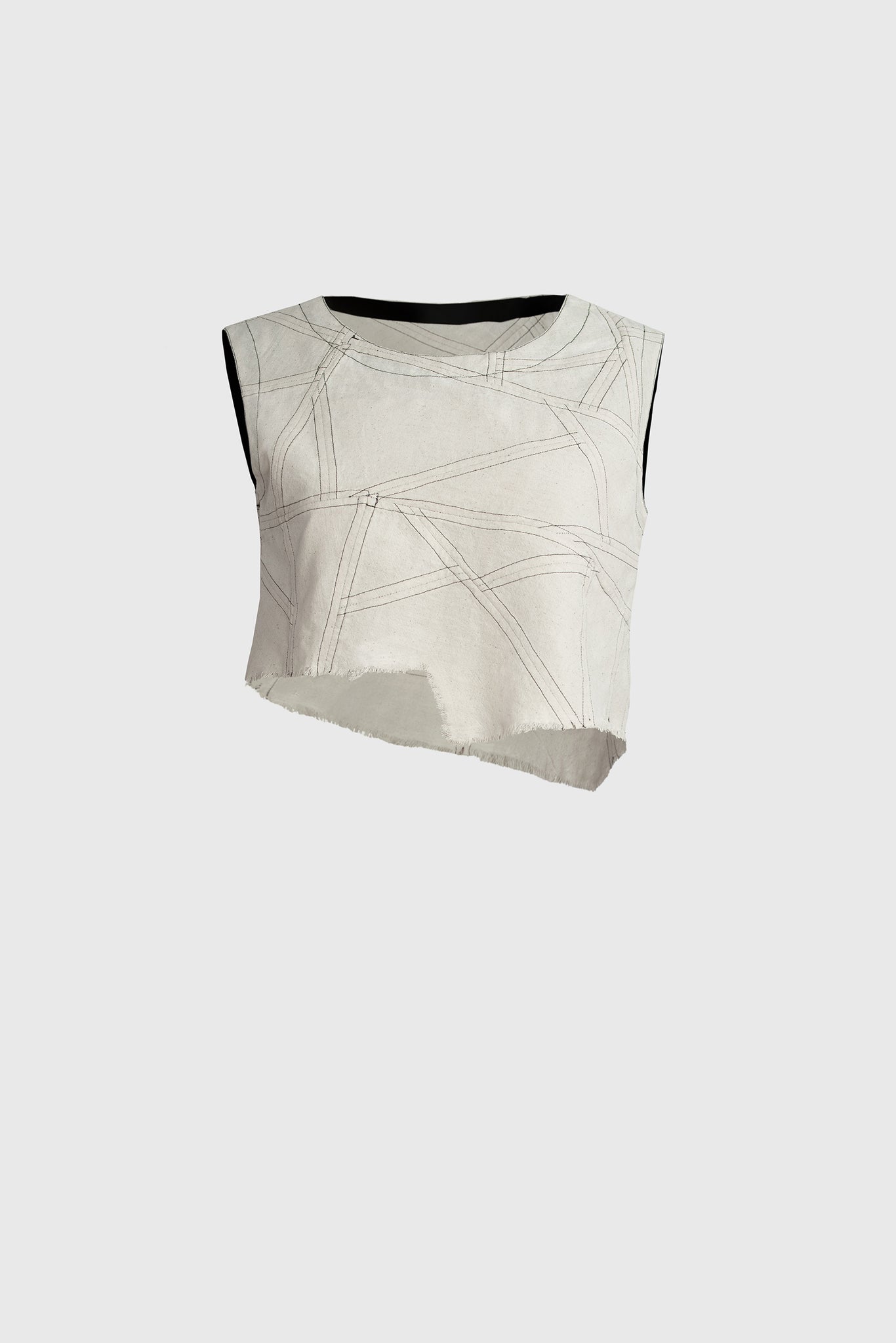 Ruxandra designed asymmetrical top, contrasting black over-thread detailing, white breathable cotton, round neckline, fringed lower hem, sleeveless, patchwork style, using recycled cotton, 90s feel, geometric look, double face