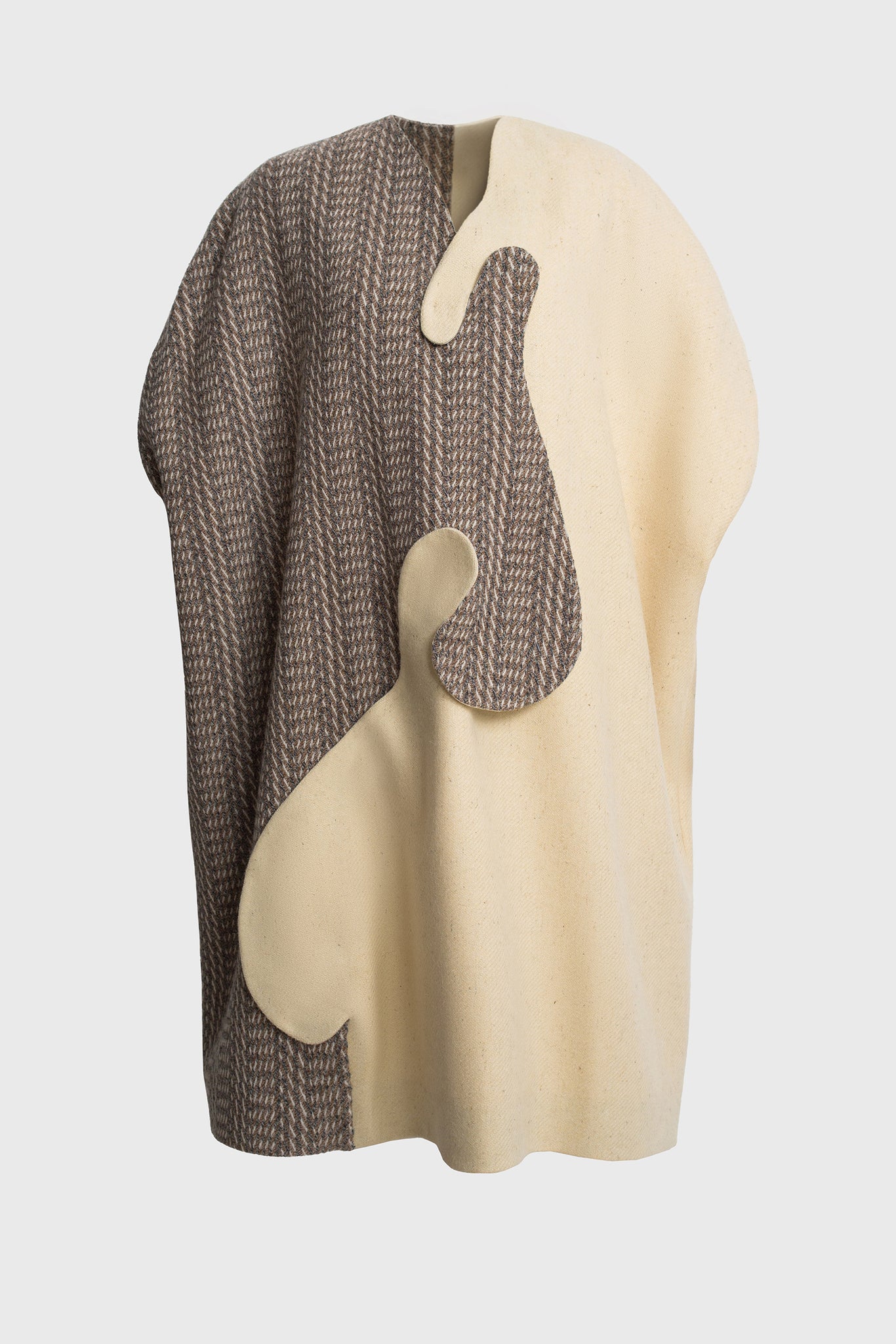 women's cape, front intricate closure, press and studs, organic round shapes, sleeveless, herringbone wool, undyed, natural, asymmetrical design, earth tones, easy to style