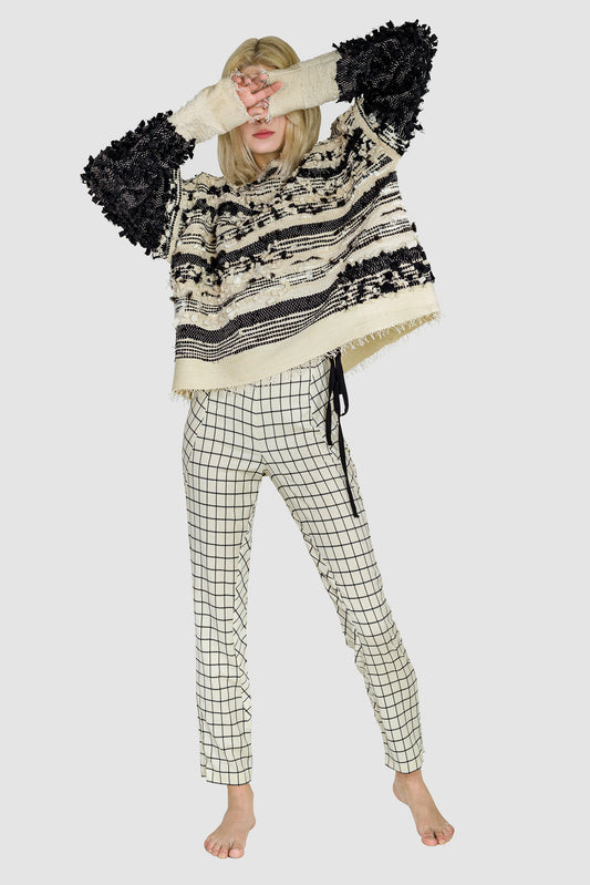 relaxed look, Ruxandra designed black and white avantgarde fashion, black and white abstract lines, grid motif, horizontal lines sweater, rhythm in the thickness of the lines, artsy look, puffy and spiky  3D shapes coming out of the sweater, irregular and abstract, confident style