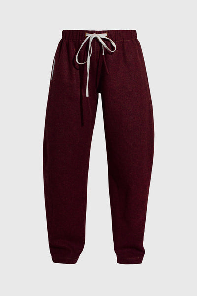 comfy curved women's pants, comfortable and relaxed silhouette, homey, Christmas vibes, gift for him or her,  unisex style, deep dark red color, white drawstring, style with a sweater or t-shirt, casual, jogging pants for cold weather, natural textile, sustainable